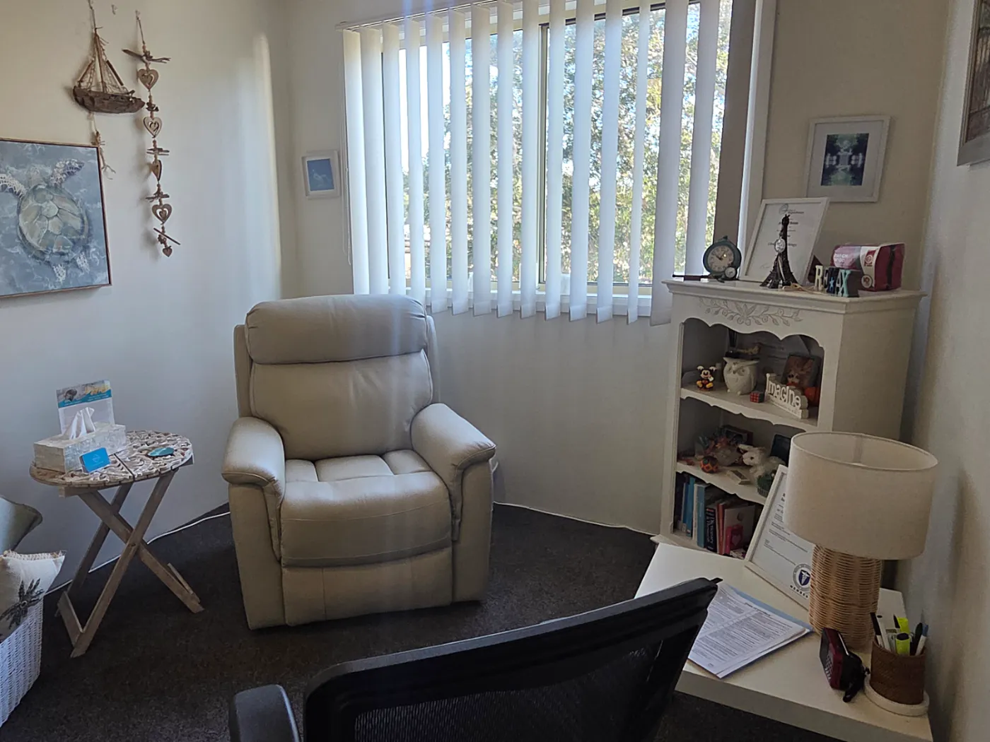 Angela's consulting room in Terrigal, Central Coast — a comfortable recliner by a light-filled window