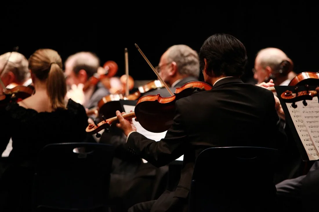 Musicians performing in an orchestra